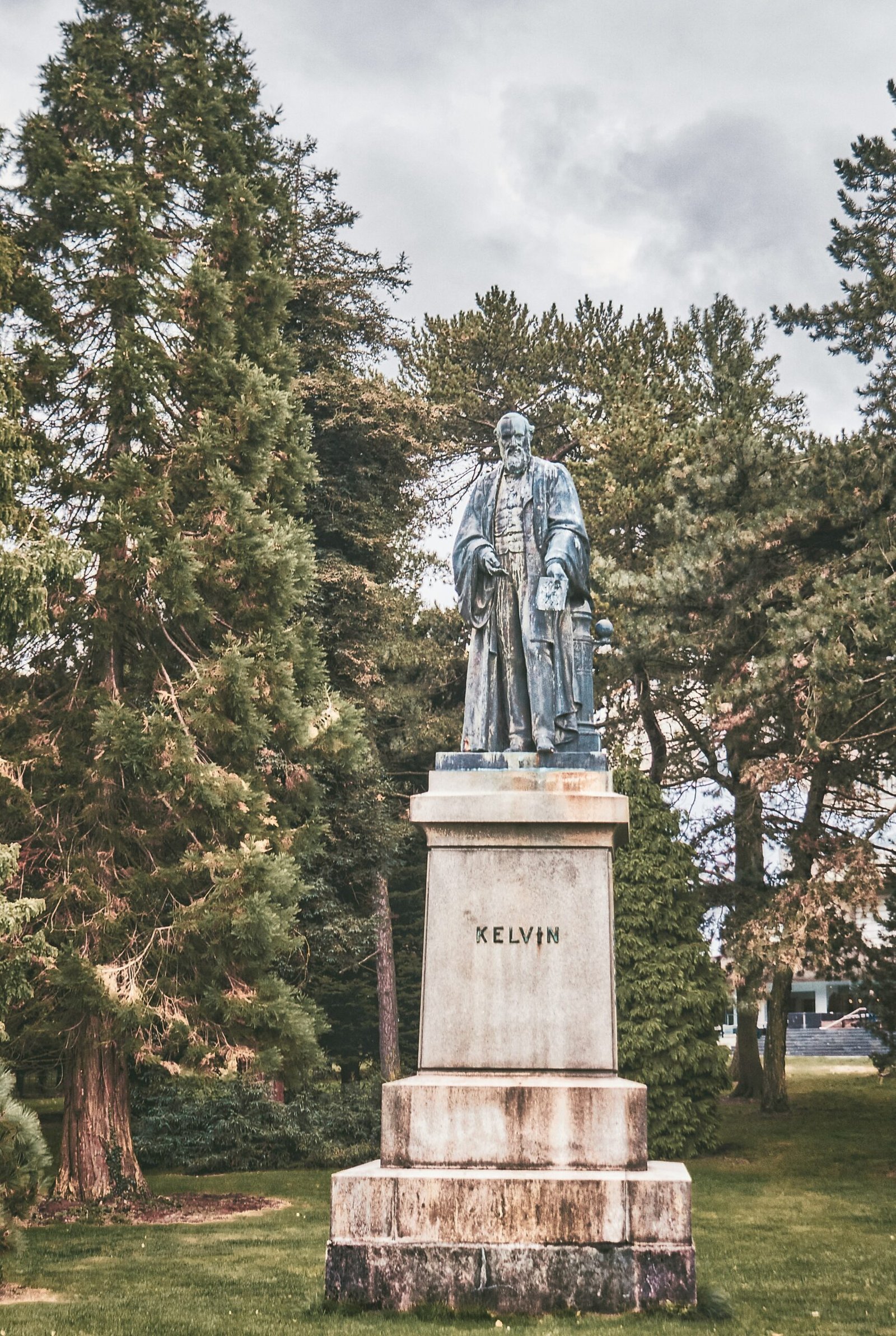 statue of man in black coat